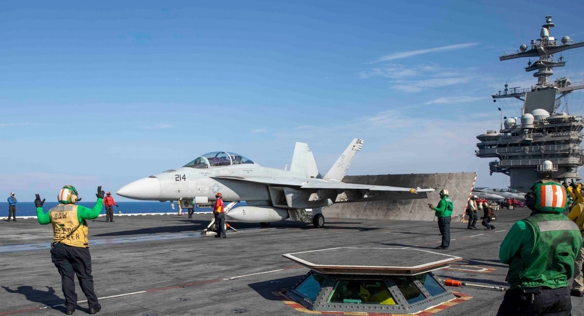 The CVN-77 air wing consists of 90 aircraft and helicopters, with a core of F/A-18 Super Hornet aircraft