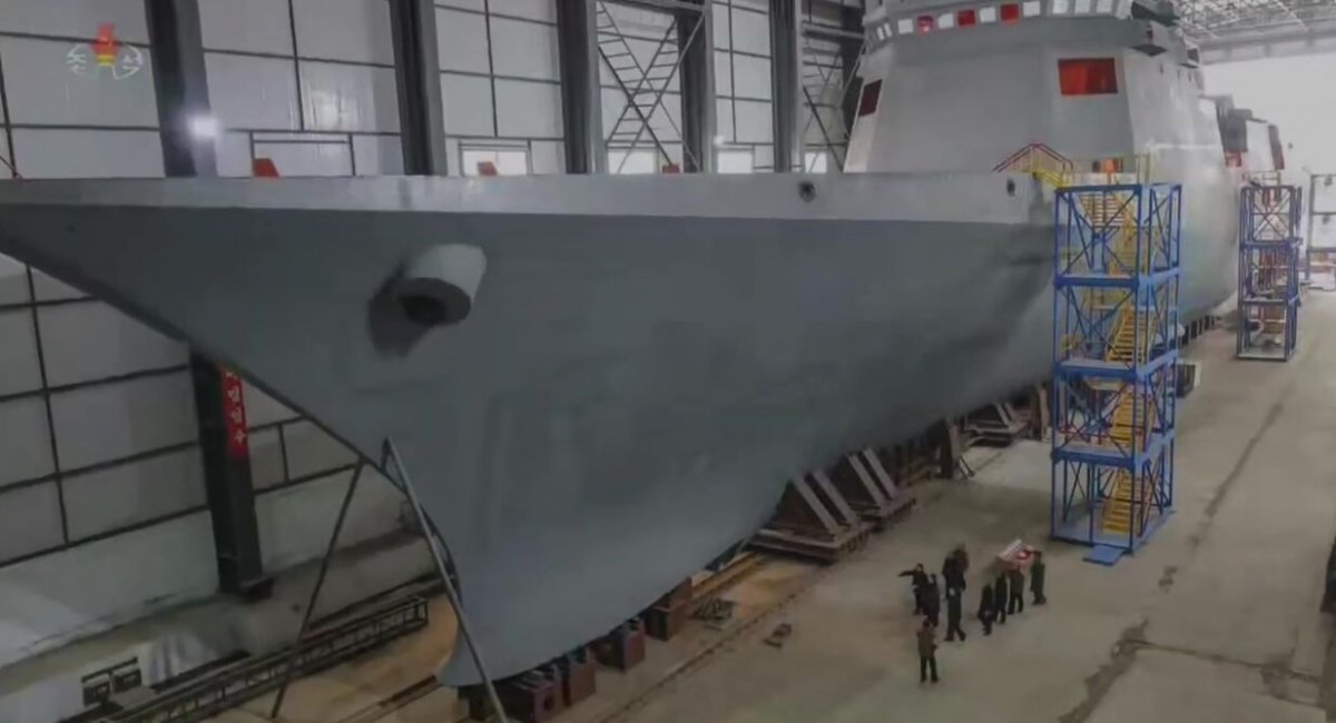 Kim Jong Un inspecting the warship at the Nampho shipyard last year after the protective shelter structure was fully installed / Photo credit: KCTV