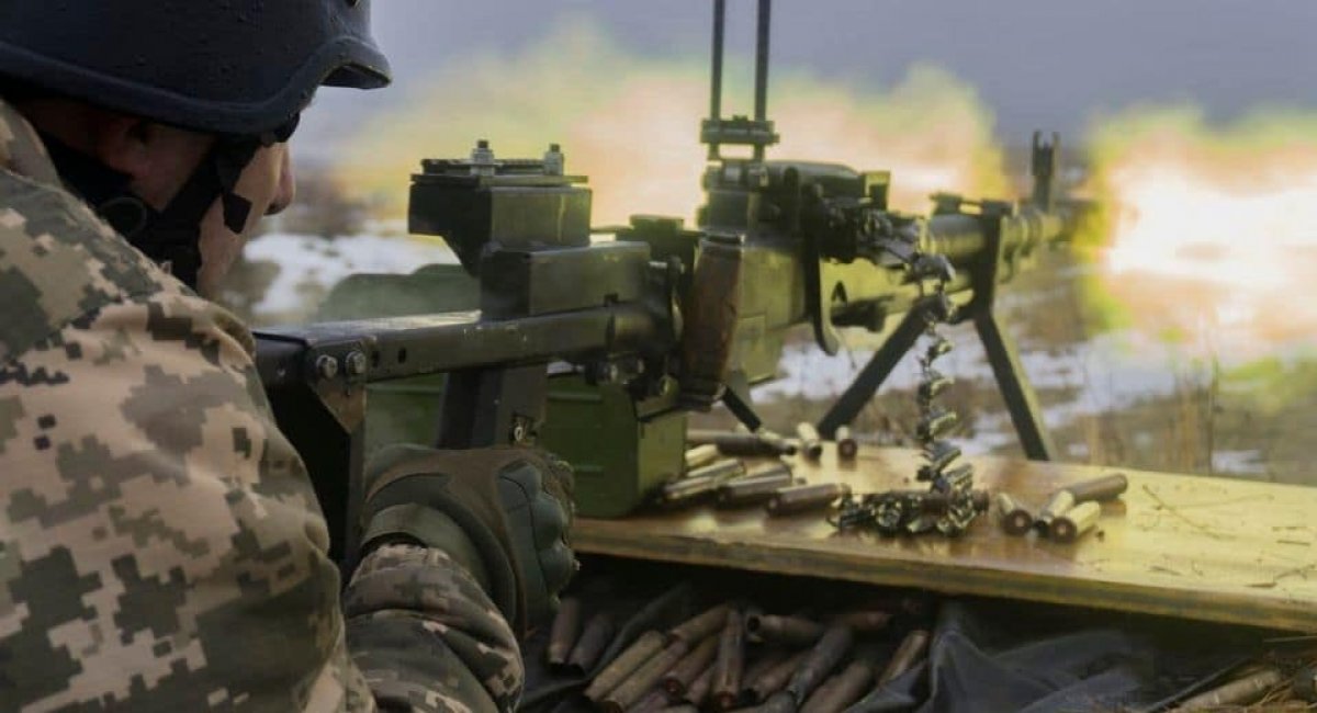 A warrior of 67th Separate Mechanized Brigade of the Armed Forces fires from a heavy machine gun. The brigade is formed on the basis of Ukrainian Volunteer Corps (Right Sector)