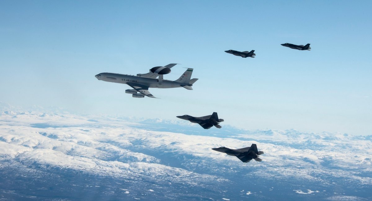 Illustrative photo: an E-3 Sentry, followed by two F-22 Raptors and two F-35A Lightning II aircraft fly over Alaska May 5, 2020 / Illustrative photo credit: US Air Force