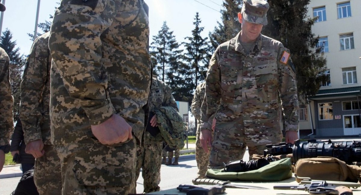 Maj. Gen. David Tabor, right, commander of U.S. Special Operations Command Europe, receives a weapons briefing at the 142nd Training Center near Kyiv, Ukraine, April 28, 2021