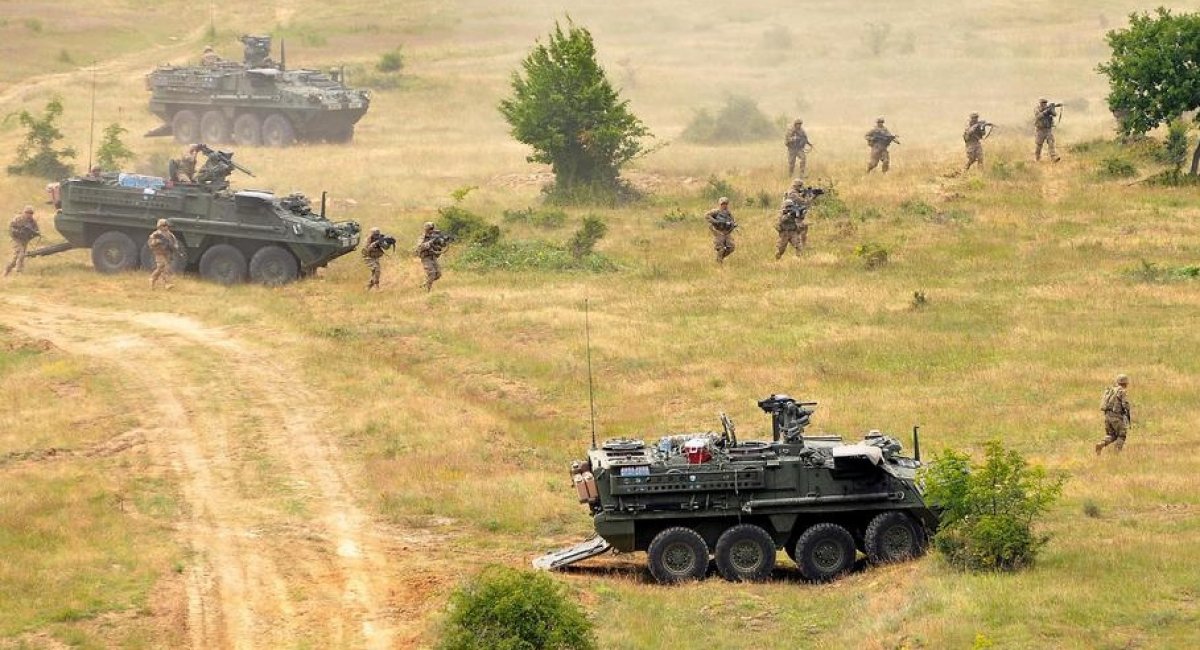 Soldiers of the 2nd Cavalry Regiment out of Vilseck, Germany, dismount from their Stryker vehicles during the live-fire exercise at Novo Selo Training Area, Bulgaria, in 2015. / Photo credit: Michael Abrams / Stars and Stripes