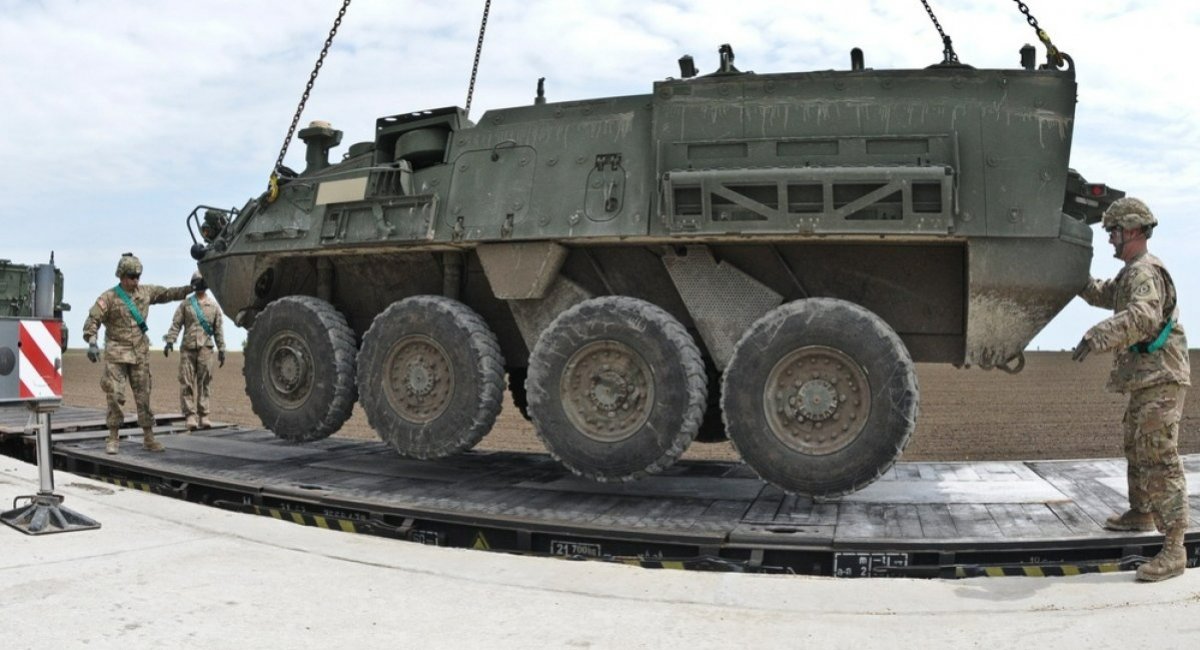 A U.S. Army Stryker armored personnel carrier is loaded onto a train in Romania / Photo credit: U.S. Department of Defense
