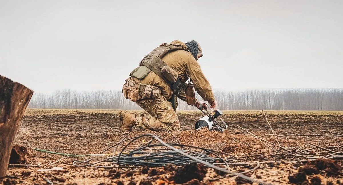 Ukrainian soldier prepares to launch a fiber-optic-guided FPV drone / Photo credit: Flying Skull UAV Battalion press service