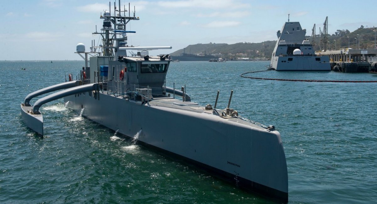 In the foreground is the Sea Hunter unmanned surface ship / Illustrative photo credit: U.S. Navy