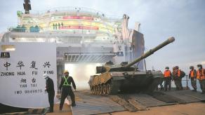 Why China Arms Civilian Ferries Transporting Electric Cars with Anti-Aircraft Lasers