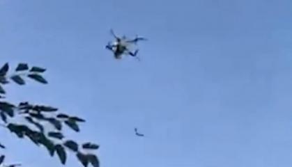 russian FPV Drone Approaches Ukrainian Fighter, Who Shoots It Down With Small Arms (Video)